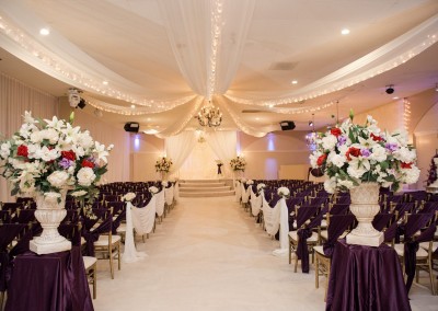 Indoor Wedding Ceremony Deep Purple and White Decor