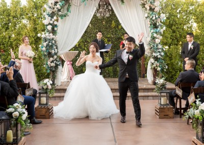 Villa Tuscana Reception Hall event showing just married couple leaving altar