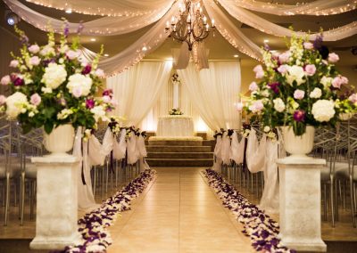 Villa Tuscana Reception Hall event showing indoor ceremony space and aisle