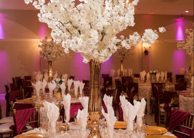 Villa Tuscana Reception Hall event showing large white floral centerpiece table decoration