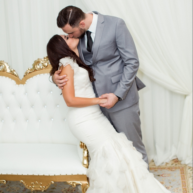 Villa Tuscana Reception Hall event showing couple kissing during photos