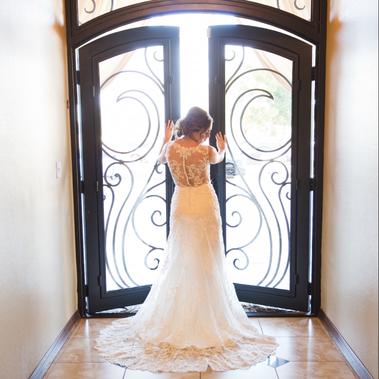 Villa Tuscana Reception Hall event showing back of wedding dress inside reception hall