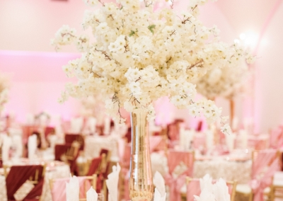 Villa Tuscana Reception Hall event showing Large white floral table centerpeice