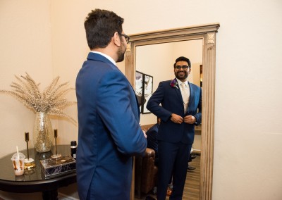 Villa Tuscana Reception Hall event showing groom adjusting suit before wedding
