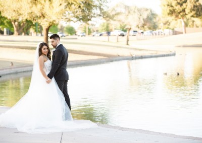 Villa Tuscana Reception Hall in mesa showing nearby park area with bride and groom by the lake