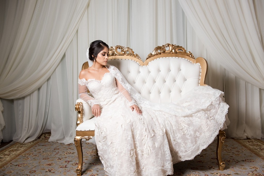 Villa Tuscana Reception Hall in mesa showing bride and groom in photo lounge on beautiful couch