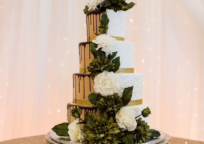 Villa Tuscana Reception Hall in mesa showing tied wedding cake in reception area on custom decorated table