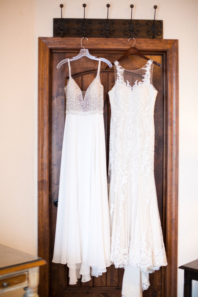 Villa Tuscana Reception Hall in mesa showing two wedding dresses hanging on the door