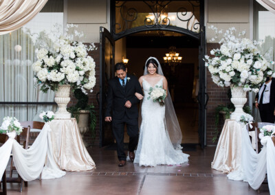 Villa Tuscana Reception Hall in mesa showing bride walking down aisle with father