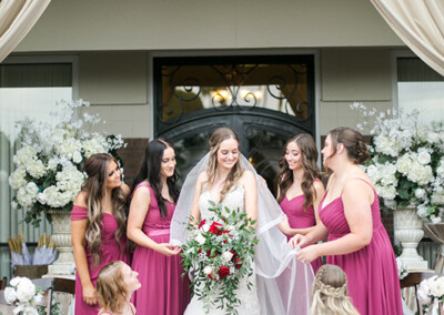 Villa Tuscana Reception Hall in mesa showing bride with bridesmaids outside